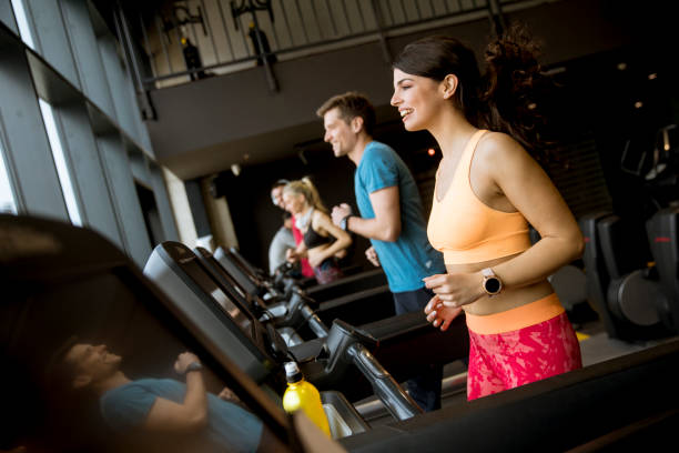istock young people running on treadmills in modern gym 1139883983