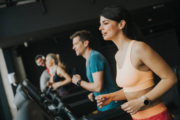 istock young people running on treadmills in modern gym 1139883990