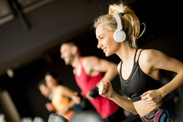 istock young people running on treadmills in modern gym 1139883993