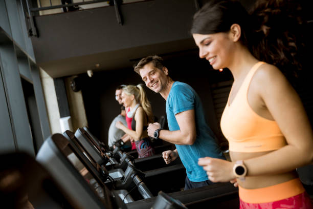 istock young people running on treadmills in modern gym 1139884002