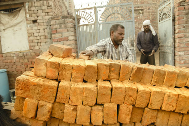 istock Men loading brick in the horse cart 1139884067