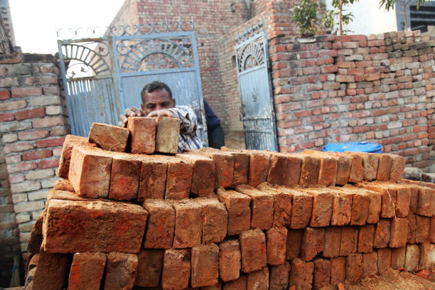 istock Men loading brick in the horse cart 1139884080