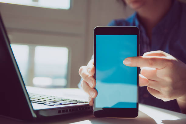 istock Close up of woman's hands using smart phone touchscreen 1139889738