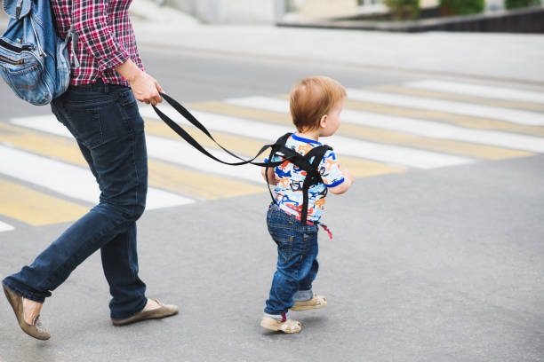 istock Mom insures her child during a walk 1139892171