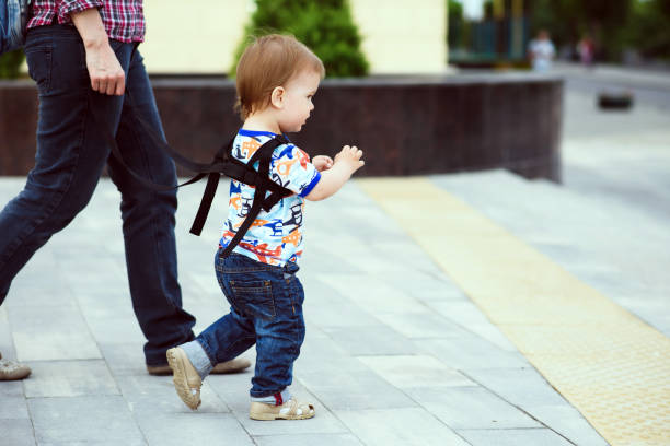 istock Mom insures her child during a walk 1139892192
