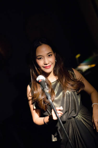 istock Thai jazz singer at microphone 1139895044