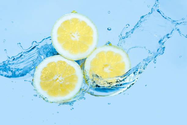 istock Water splashing on slices of lemon 1139895180