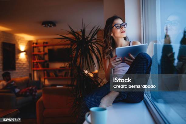 Doing Some Overtime At Home Stock Photo - Download Image Now - Domestic Life, Women, Window