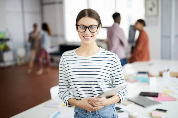 istock Creative Young Woman Posing in Office 1139897901