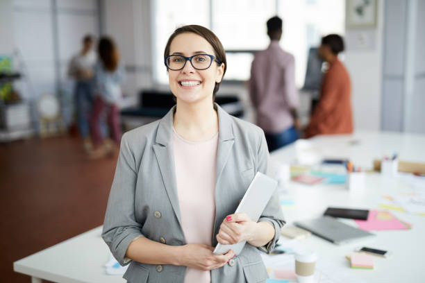 istock Smiling  Businesswoman Posing in Office 1139897907