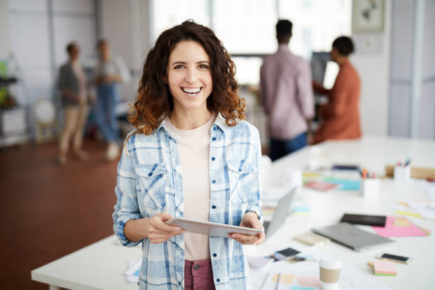 istock Creative Woman Smiling in Office 1139897922