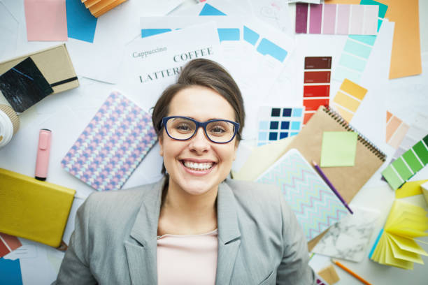 istock Smiling Businesswoman Lying on Floor 1139898035