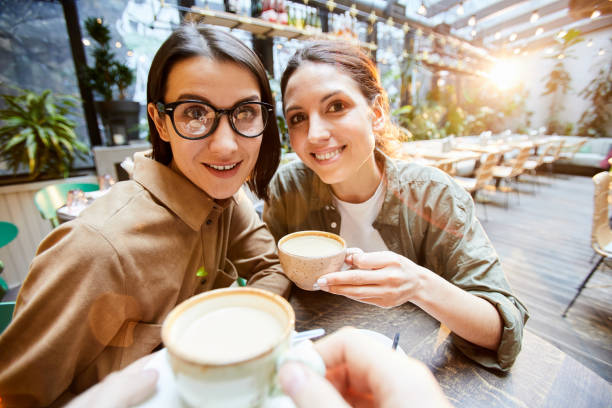 istock Content ladies resting in modern coffee shop 1139899226