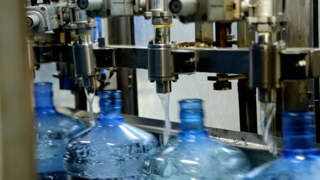 Filling Bottle with Water in Factory