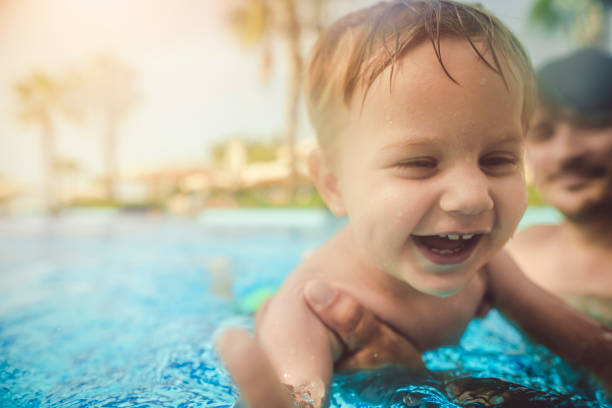 Father with son enjoying summer vacations in resort