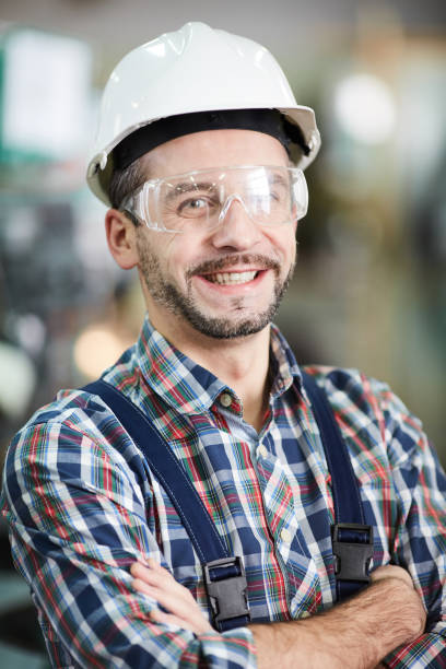 istock Mature Factory Worker Smiling 1139899566