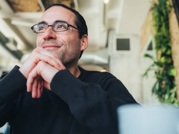 Caucasian man having a coffee at the small bistro