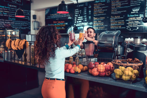 istock Modern Female Taking Smoothies From Barista 1139903469