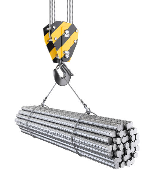 istock Crane hook hanging on a steel ropes with big steel reinforcement pack. 1139903752