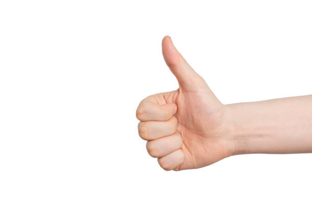 istock male hand with approving gesture - thumb up, on a white background. 1139906993