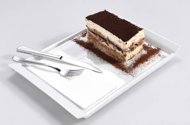 istock Tiramisu cake slice on a white plate. 1139909422