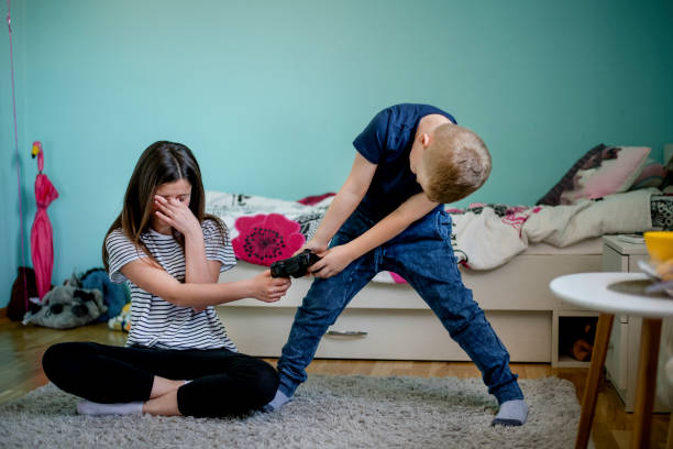 Two kids fighting stock photo