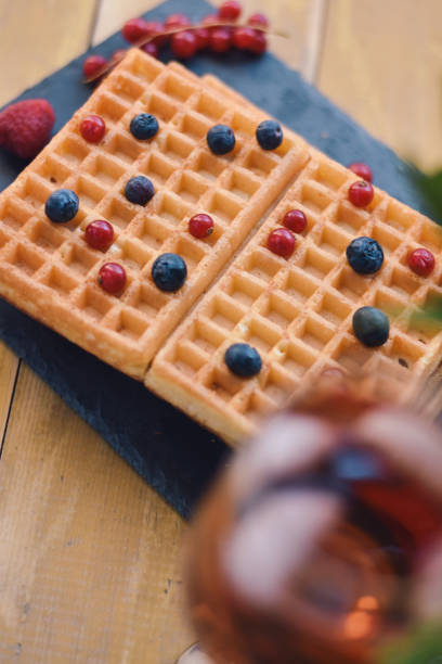 istock Waffles with fruits on wooden background 1139913089