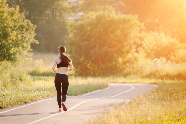 istock young woman running in park 1139913868