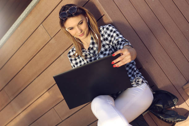 istock Woman with laptop in city 1139914078