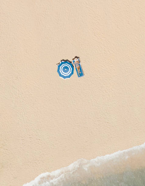 An aerial view of sun umbrellas on the beach