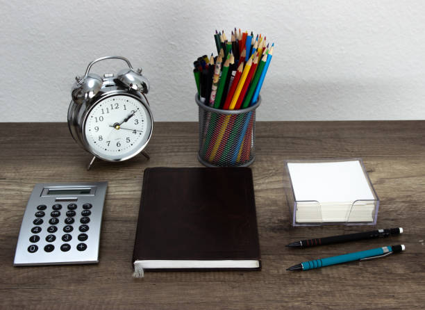 istock Time planning, daily agenda notebook on a wooden working table opened an ready for notes. Home work place/office 1139918642
