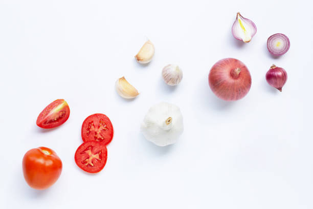istock Fresh vegetables on white background.  Tomato, Red onion, garlic, 1139919260