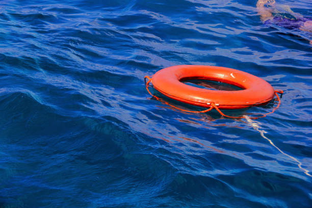 istock Orange buoy floating in the blue sea. 1139922256
