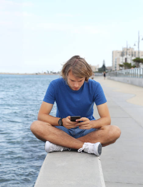 istock Teenage boy typing text message.Using smart phone. 1139923032