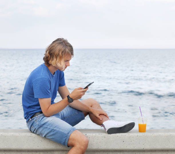 istock Teenage boy typing text message.Using smart phone. 1139923038