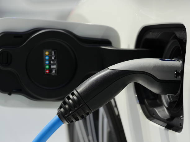 istock Electric vehicle power station plug close up 1139923281