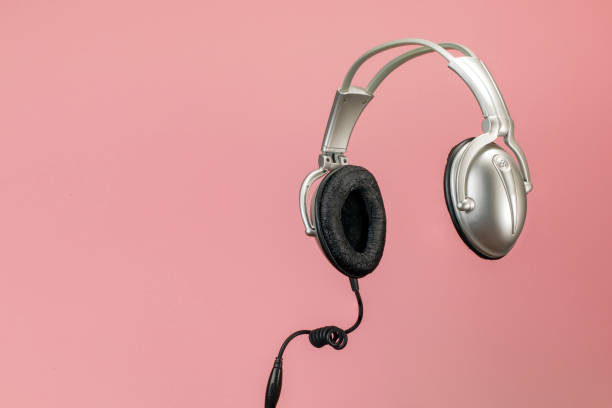 istock Headphones isolated on a pink background 1139924093