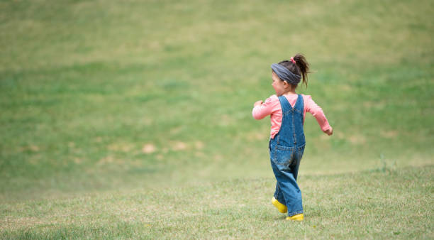 istock Girl walking on the meadow 1139924111