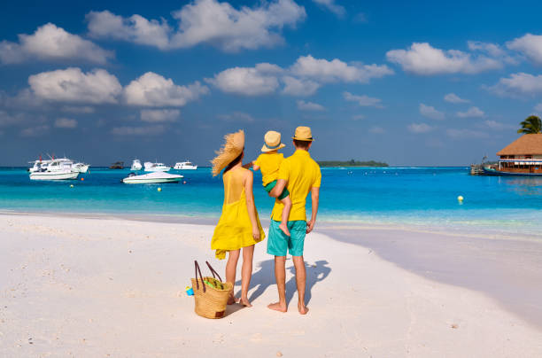 istock Family with three year old boy on beach 1139924737