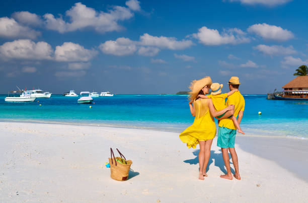 istock Family with three year old boy on beach 1139924765