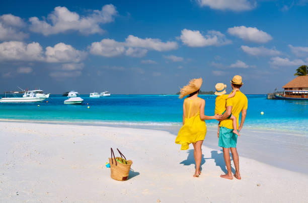 istock Family with three year old boy on beach 1139924787