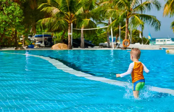 Photo of Toddler boy in resort swimming pool