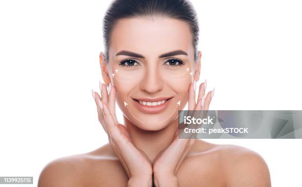 Smiling Woman With Lifting Arrows On Face Concept Of Skin Lifting Stock Photo - Download Image Now