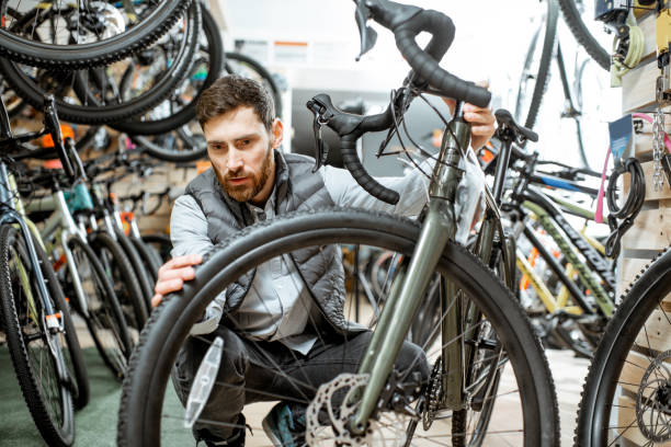 istock Man choosing bicycle at the store 1139926727