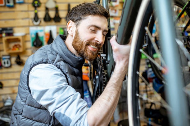 istock Man at the bicycle shop 1139927394