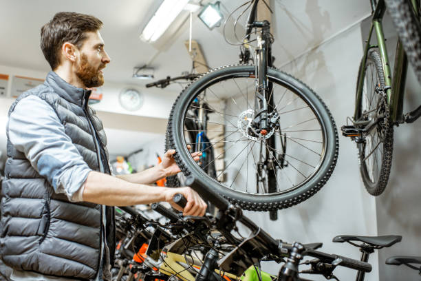 istock Man choosing bicycle at the store 1139927577