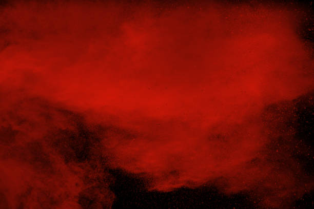istock Red powder explosion on black background. Freeze motion of Red dust particles splash. 1139928371