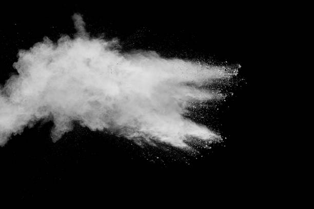 istock Bizarre forms of white powder explosion cloud against black background.White dust particles splash. 1139928396