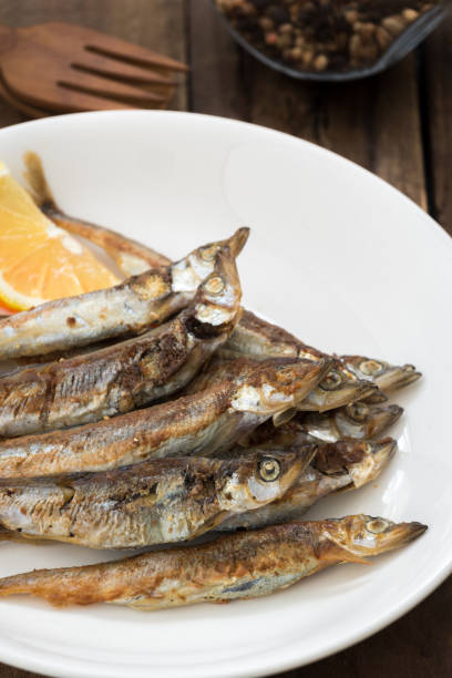 istock Grilled fish capelin or shishamo on white plate 1139930651