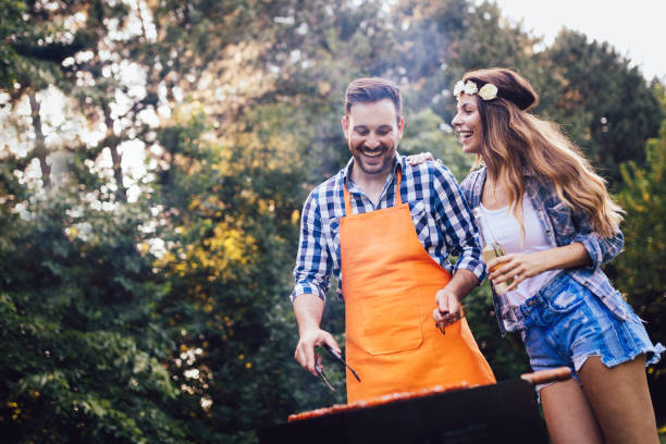 istock Beautiful woman and handsome man having barbecue 1139931012